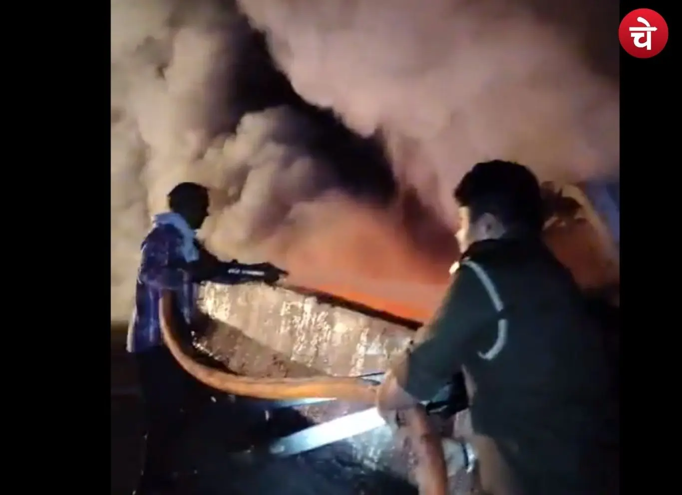Fire department personnel and police officers bringing the fire under control